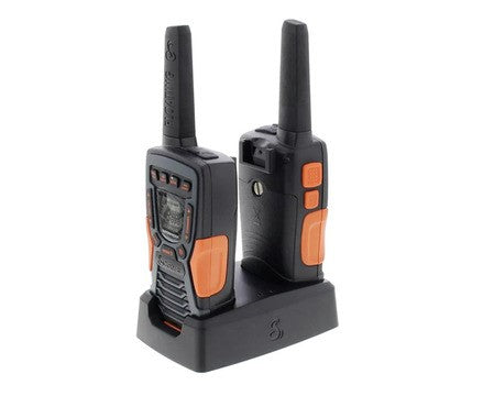 Two Cobra walkie talkies in charging cradle