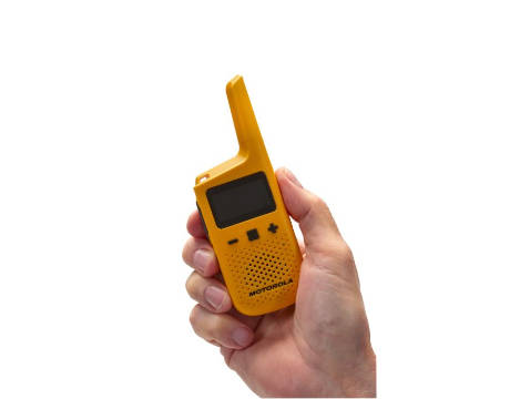 Hand holding Motorola T72 walkie talkie