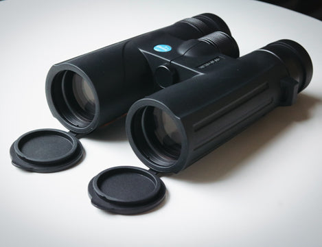 Binoculars next to fabric case