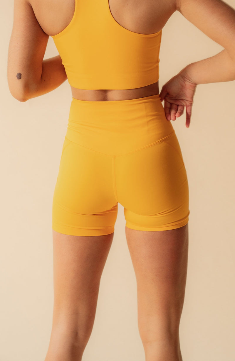 ethical sustainable yellow activewear short girlfriend collective