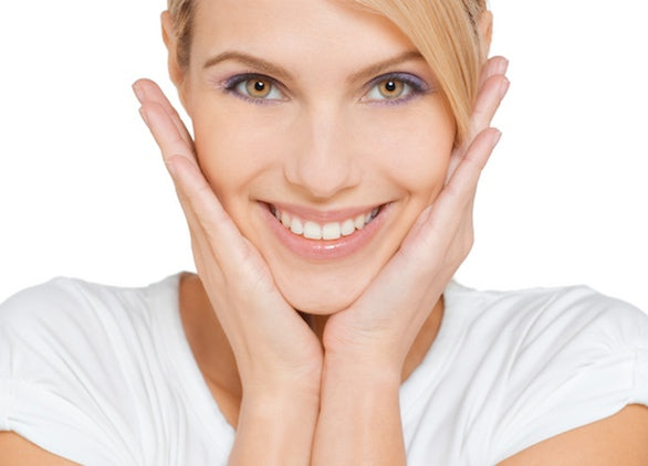 A woman doing facial exercises