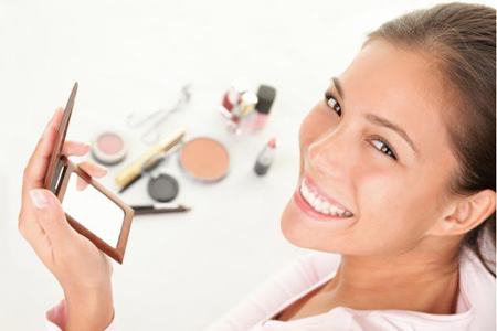 A girl applying make-up at home