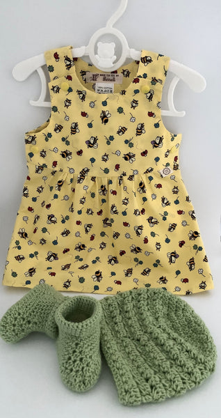 Pinafore dress with bee print on yellow background