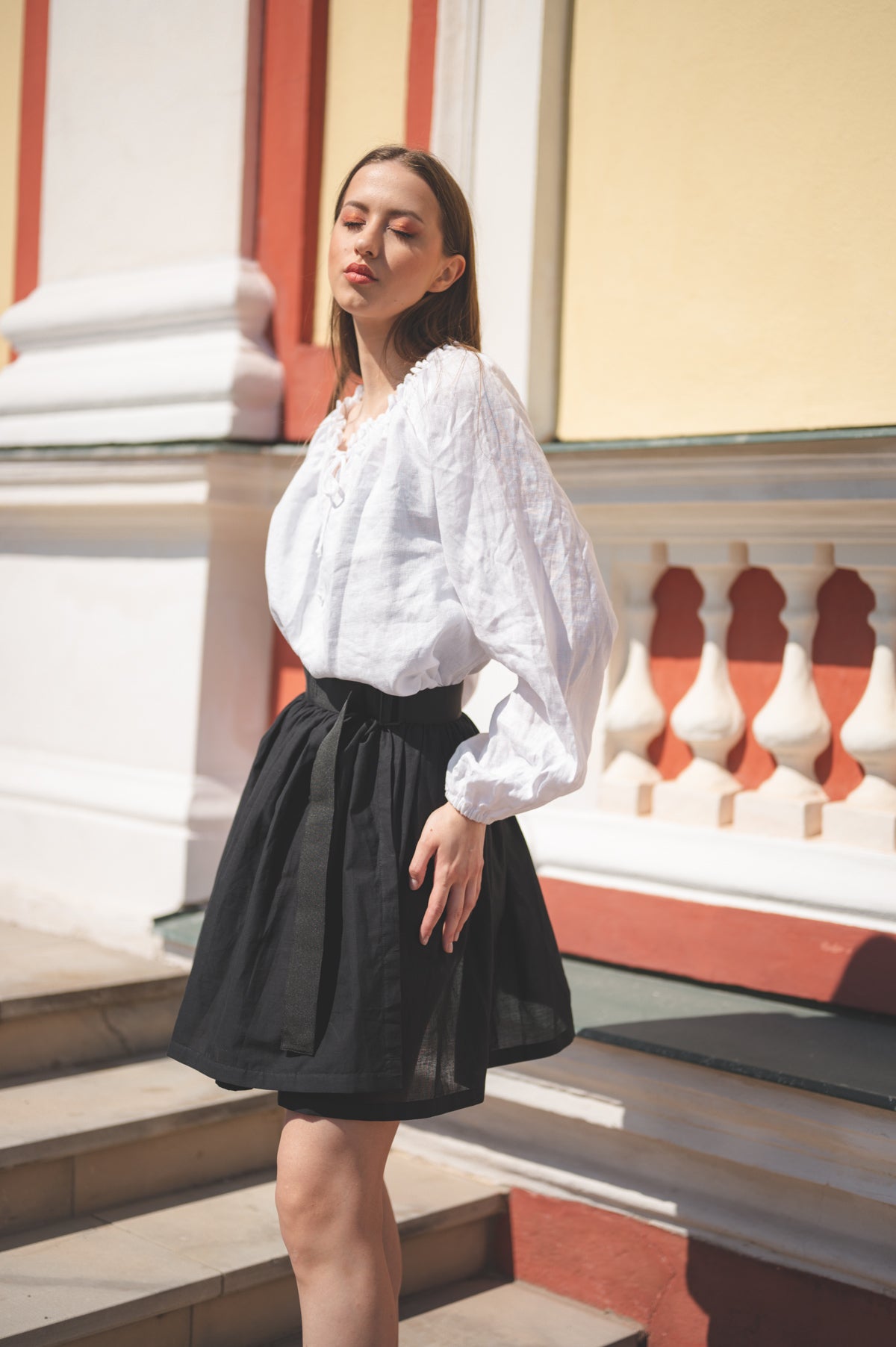 MAI Linen Blouse in White paired with Adele Skirt Mini in Black.