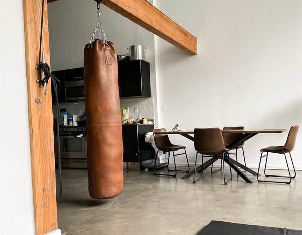 Are you looking for a way to dampen the vibration from your basement hung heavy  bag Take 1 20 inch bike tire tube a  Diy home gym Punching bag Gym  room at home