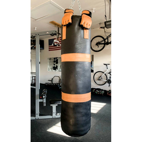 Vertical photo of a punching bag hanging from ceiling Stock Photo - Alamy
