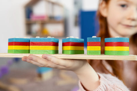 Child holding a montessori shape sorting toy