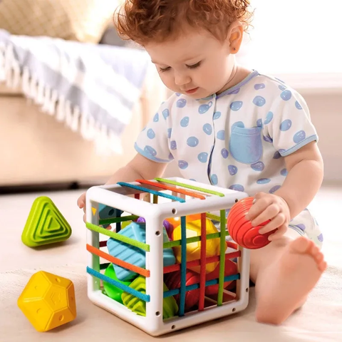 baby-playing-with-coloured-montessori-sensory-shape-toys