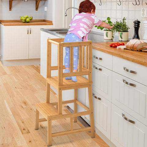Toddler standing on kitchen tower