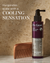 A purple and silver bottle of Dr. Groot Scalp Revitalizing Solution Scalp Relief Tonic with black pump cap standing in the bathroom corner with a comb leaning on it and white text over it saying "Invigorates scalp with a cooliong sensation".