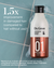A white and copper red bottle of Dr. Groot Professional Bonding System Bond Fortifying #1 Shampoo with black cap lying on a light blue tile floor in a bit of shampoo foam with white text over it saying "1.5x Improvement in damaged hair (compared to hair without use)* *Based on an in-house clinical test of 30 hair tresses using Bond Fortifying Shampoo, Keratin Water Treatmen, Conditioner and Serum together."