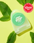 A container of Reach POP Peppermint Dental Floss lying on a light green table among the leaves of mint. A red sticker in the top right corners is saying "Best of beauty award winner. Allure. The beauty expert 2023"