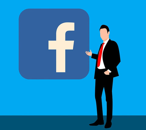 homem de negócios apontando para o logotipo do facebook, que é uma plataforma popular de social selling