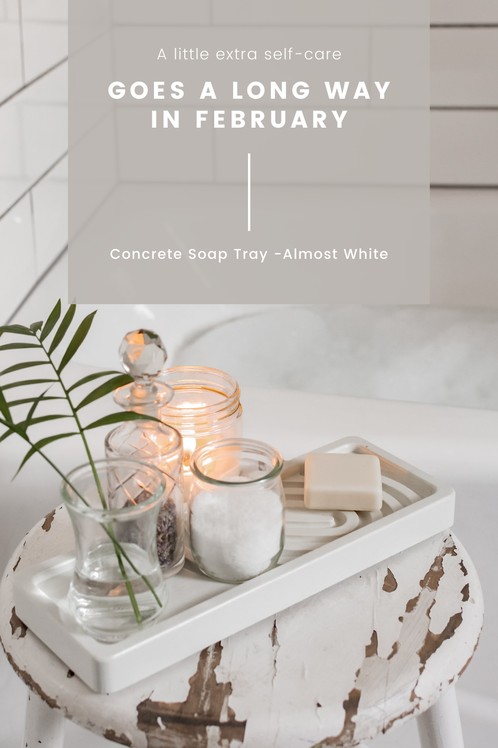 white concrete soap tray on stool by bubblebath