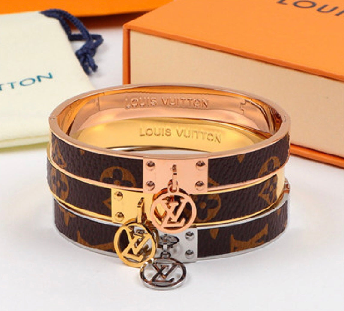 Louis Vuitton Titanium and Leather inlaid bracelet with LV Logo ring - - Nore Systems