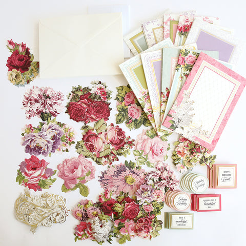 A collection of cards, envelopes, and flowers.