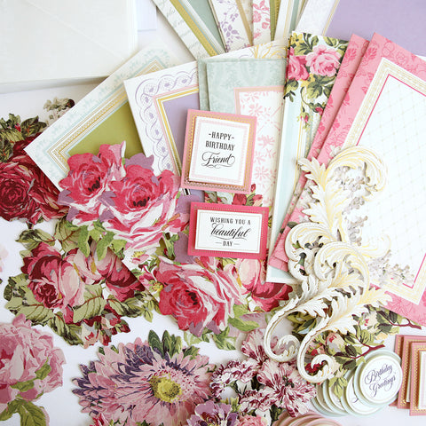 A collection of cards and papers with flowers on them.