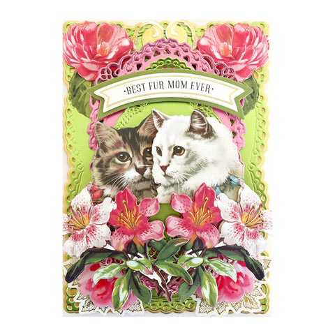 A card with two cats and flowers on it.