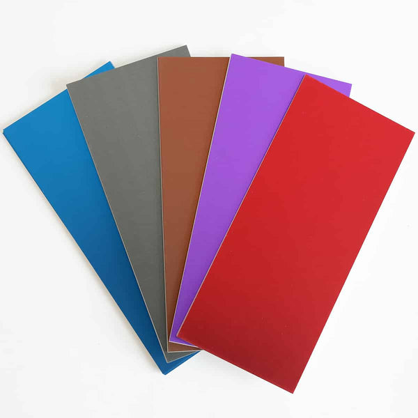 A set of colored plastic sheets on a white surface.
