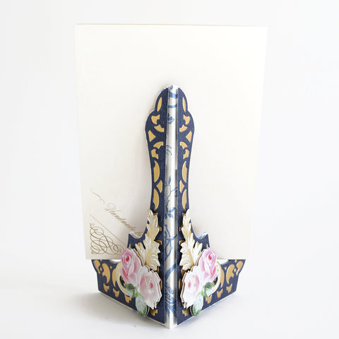 A blue and white card holder with flowers on it.