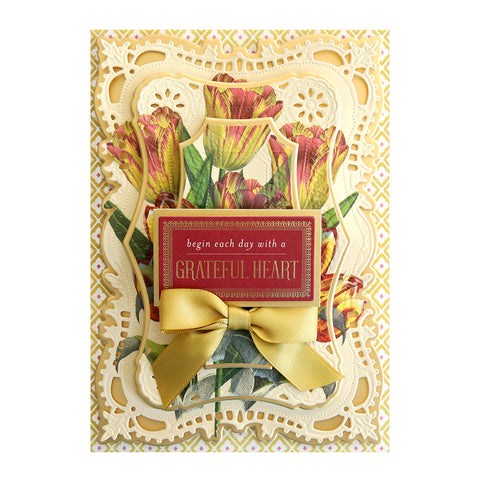A card with tulips and a yellow ribbon.