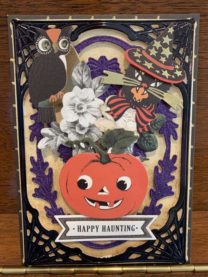 A halloween card with owls and pumpkins.