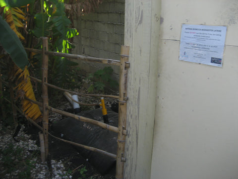 A methane digester powered by a human toilet in Port Au Prince, Haiti. This community toilet created enough methane to power the community kitchen.            – B. Trauth