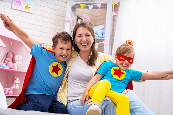 mother, son and daughter laughing together