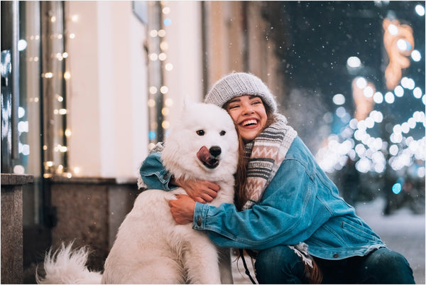 woman hugging her dog