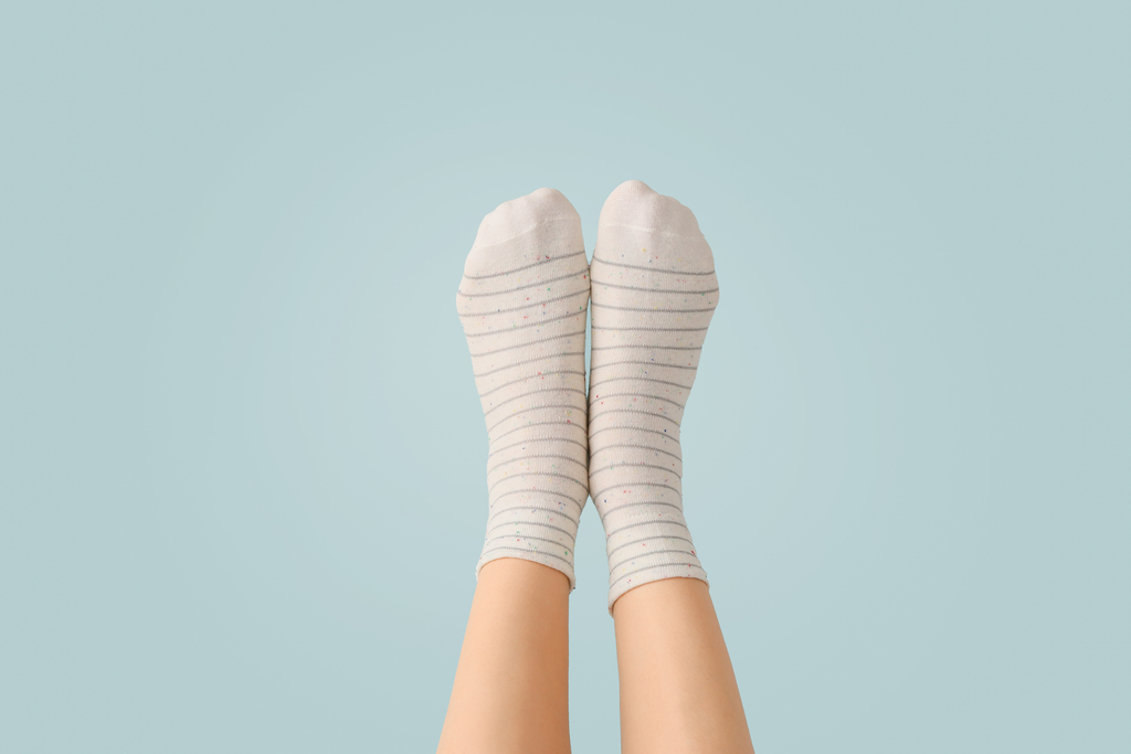 You can prevent smelly feet with moisture wicking socks that keep the feet dry.