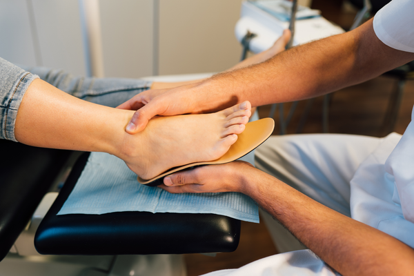 Foot and ankle pain can be treated with orthotic insoles and supportive shoes.