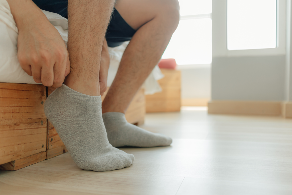 The best socks for sweaty feet are merino wool socks, sweat wicking socks, and socks with mesh ventilation.