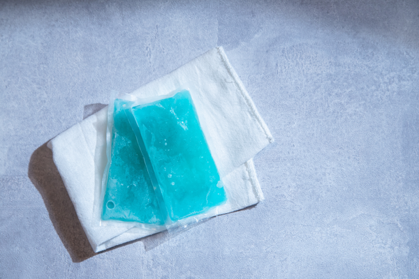 Using an ice pack or cold compress on a strained muscle can numb pain locally.