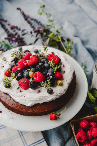 chocolate cake with coconut cream and berries