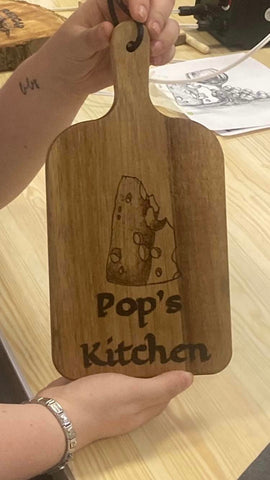 Pyrography on a chopping board created at a group workshop to be given as a gift