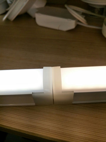 Translucent end-cap design that eliminates the dark zone between T5 connections 