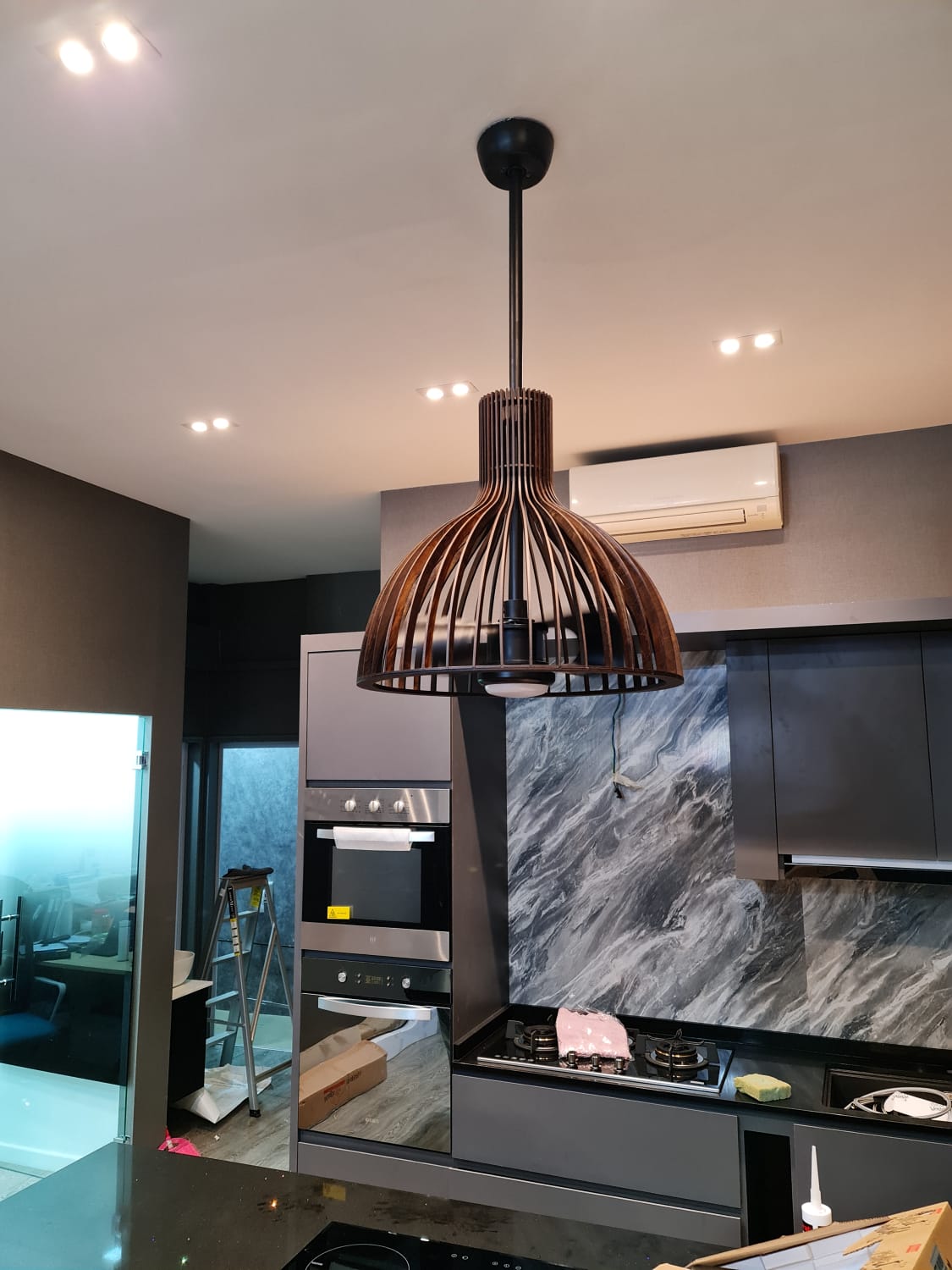 three pendant lights over dining table