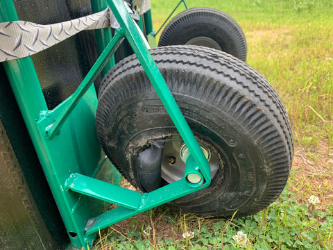 The blown tire and bent wheel from unloading with 42 gallons of fuel