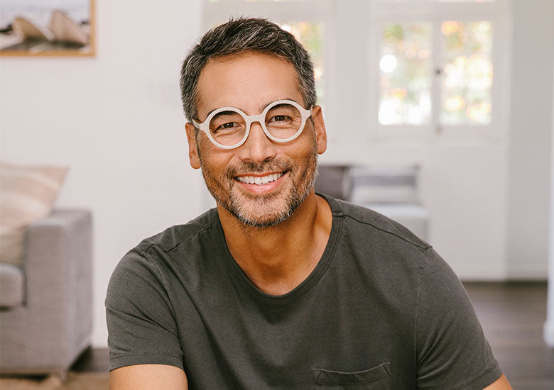 Man sitting in kitchen wearing Peepers Blue Light Glasses Reed