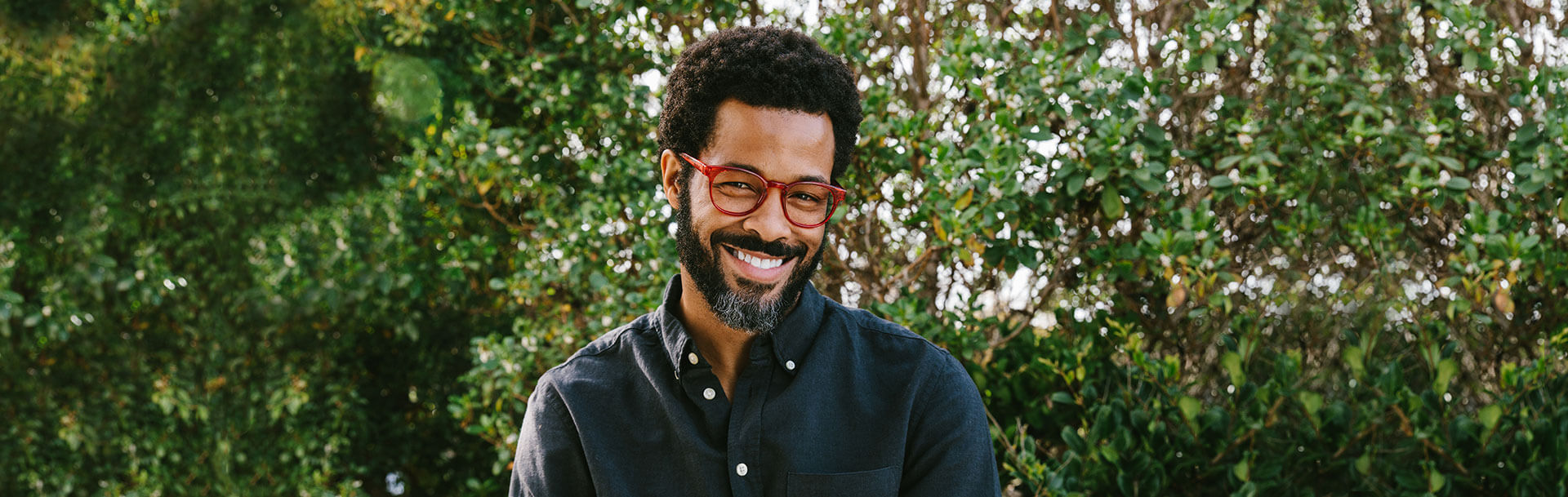 Man Standing Outside In front of Trees Wearing Peepers Blue Light Reading Glasses Duke