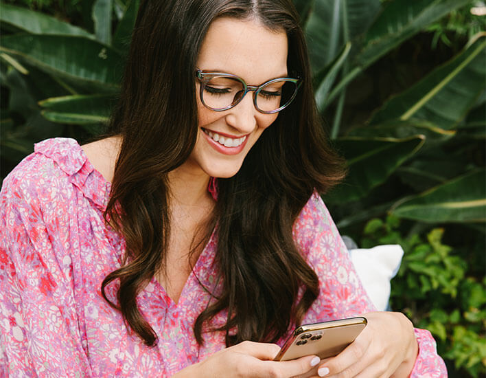 Brunette woman in Moonstone looking at screen