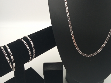 sterling silver chains on black jewellery stands