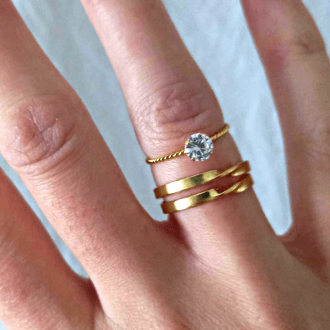 woman wearing gold stacking rings