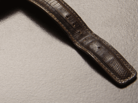 An old watch with a crease in the strap