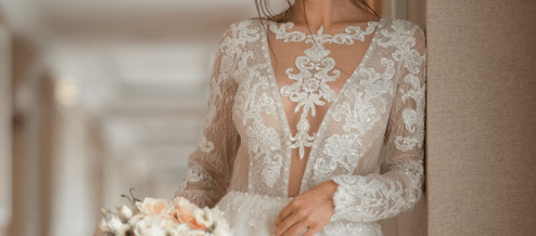 a woman wearing a high neck wedding dress
