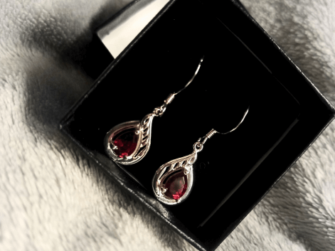Garnet earrings in a jewellery box
