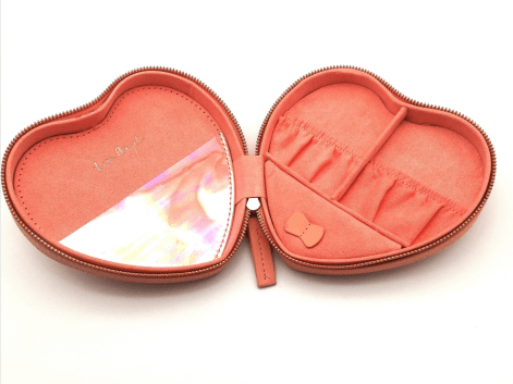 pink heart shaped jewellery box on a white background