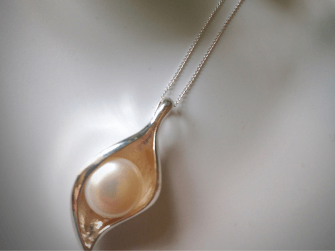 Pearl shell necklace on a white background