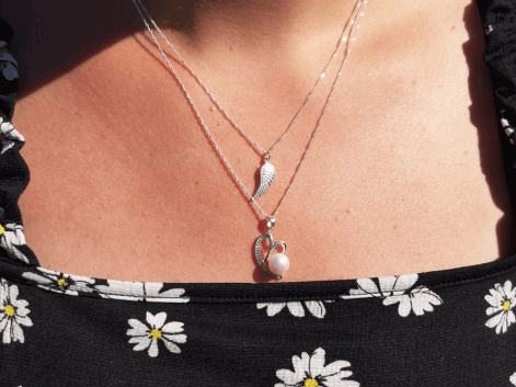 woman wearing a sterling silver necklace stack