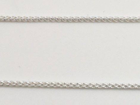 Silver spiga chain on a white background